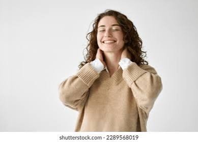 Woman smiling with hands on neck after medial branch block pain relief